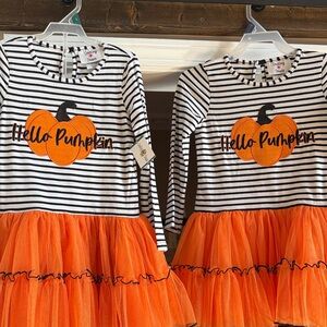 Two pumpkin dresses 
Brand new Never worn